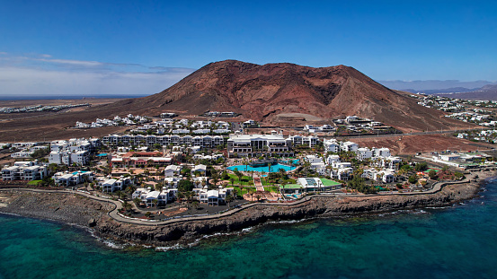 Swimming pool with waterfall and building of luxury hotel, Tenerife island, Spain