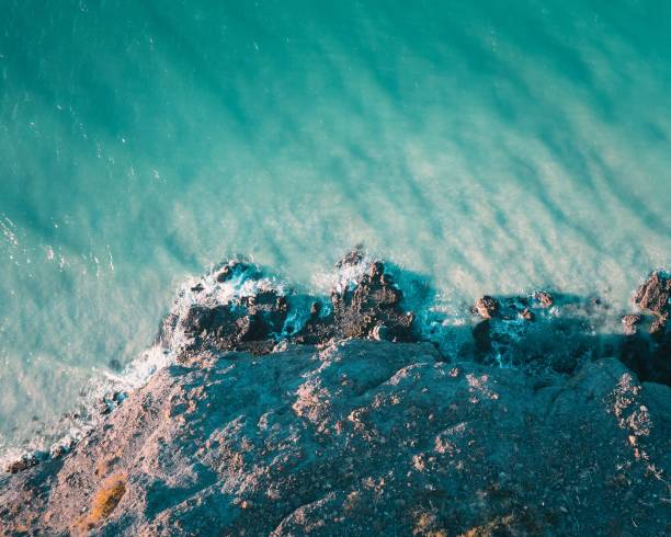 istock Aerial view of sea waves breaking beach 1488367447
