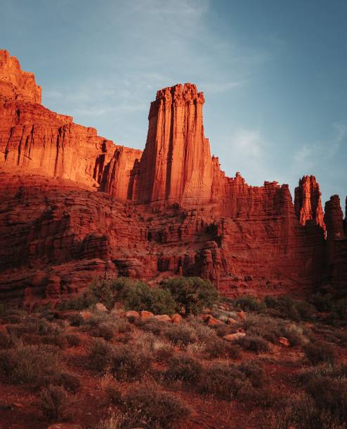 istock View of rock formations surrounded by grass under blue sky 1488367462