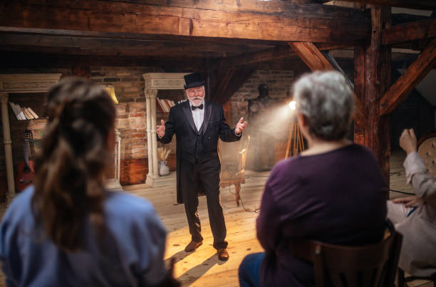 istock Senior man actor performing on stage for a an audience 1488369062
