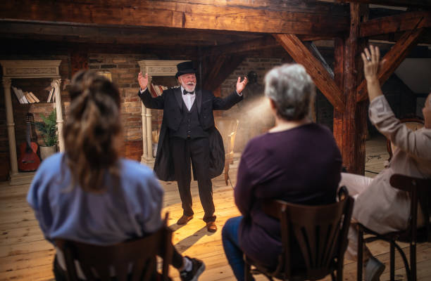 istock Senior man actor performing on stage for a an audience 1488369080