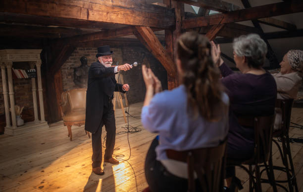 istock Senior man actor performing on stage for a an audience 1488369135