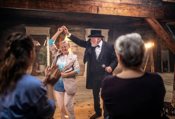 istock Senior man actor performing on stage for a an audience 1488369150