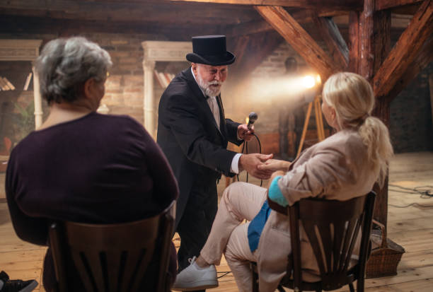 istock Senior man actor performing on stage for a an audience 1488369690