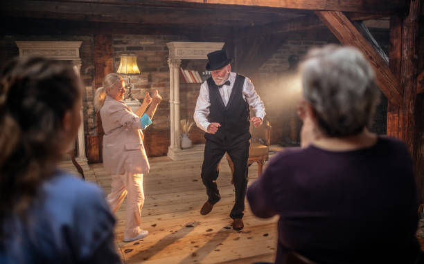 istock Senior man actor performing on stage for a an audience 1488369740
