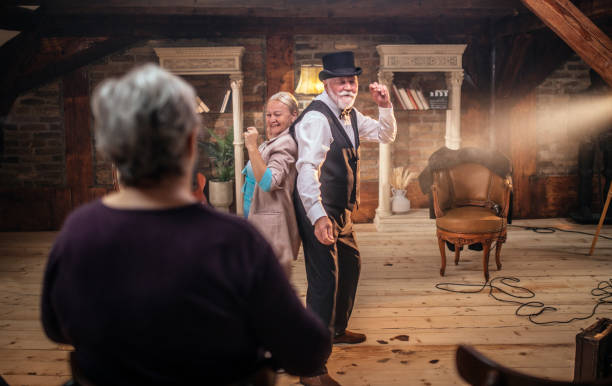 istock Senior man actor performing on stage for a an audience 1488369746