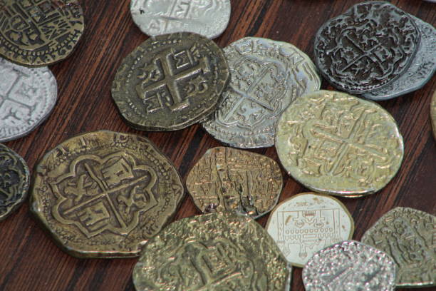 istock Spanish Coins Laid Out On Display. 1488370309