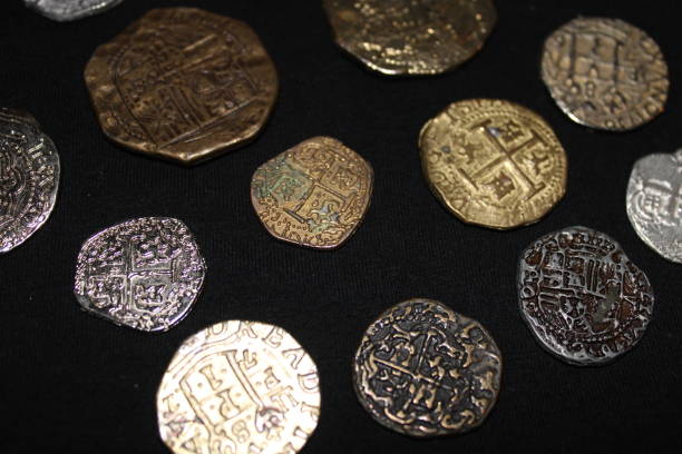 istock Spanish Coins Laid Out On Display. 1488370494