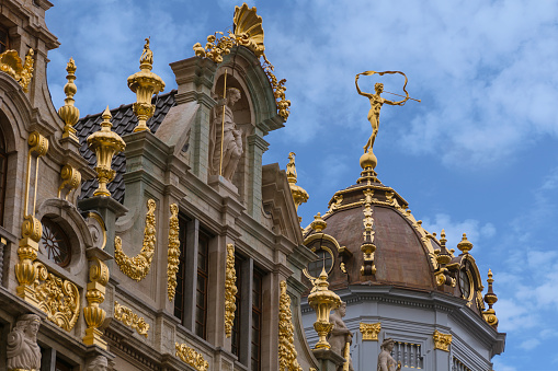 Brussels, Belgium. October 16, 2015: Brewers House from the year 1698. Facade of Gran Place buildings in the Baroque style with various golden ornaments, flowers and statues.
