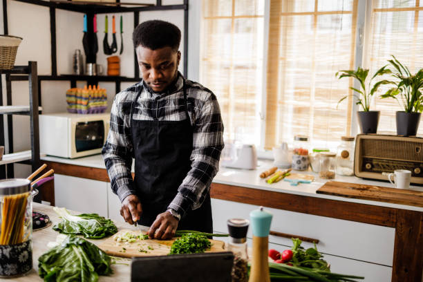 istock Man learns online how to cook healthy meals 1488375102