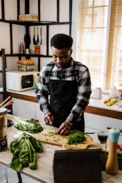 istock Man learns online how to cook healthy meals 1488375122