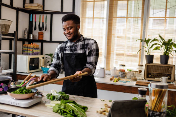 istock Handsome young man prepares meal for loved one at home 1488375234