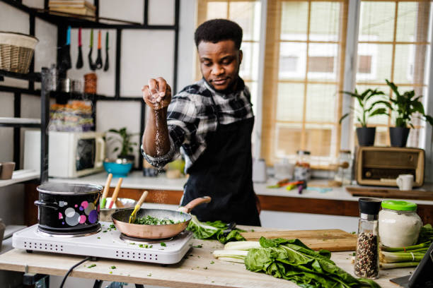 istock Chef puts spices in healthy meal 1488375356