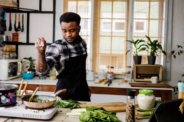 istock Man puts spices in meal 1488375365