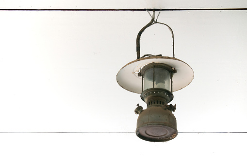 Old retro lamp hanging on ceiling