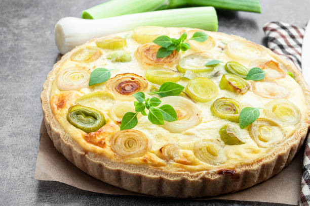 istock Quiche with leek and cheese on gray background 1488381400