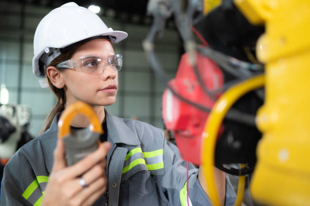 istock In the robots warehouse, A female engineer inspects the electrical system of every robotics arm, before delivering to the customer. 1488382950
