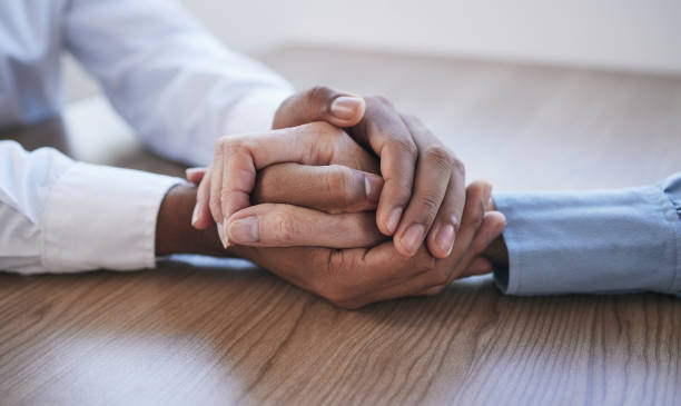 istock Closeup, holding hands and people with support, partnership and collaboration for compassion, helping and cancer. Zoom, hand or teamwork with empathy, meeting or community care, depression or sad 1488389666
