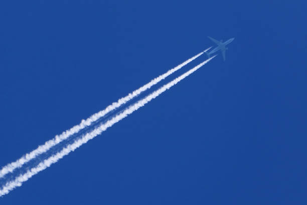 istock contrail from an airplane in the blue sky 1488391135