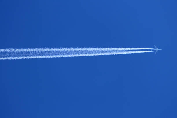 istock contrail from an airplane in the blue sky 1488391482