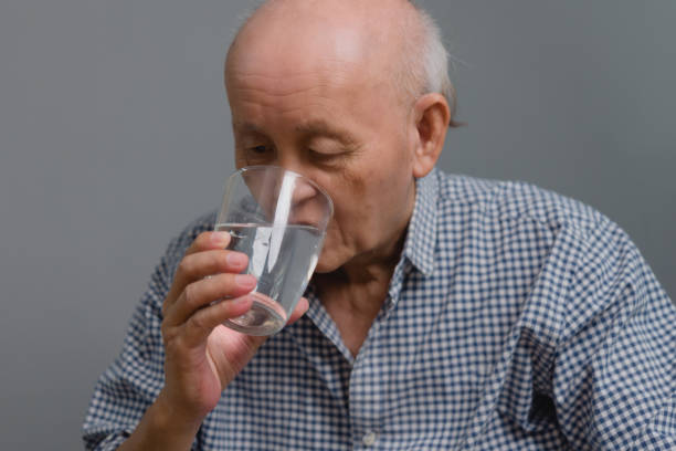 istock Asian elderly man drinking healthy water 1488395888