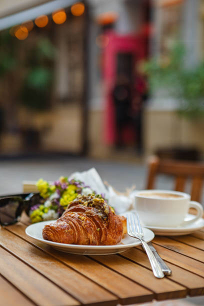 istock With croissants and coffee on the summer terrace 1488397381