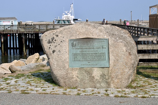 Plymouth, MA, USA, 09.14.21 - A large boulder with a metal plaque in it. It reads \