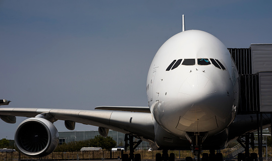 A United States Air Force McDonnell Douglas / Boeing C-17 Cargo plane taxiing.\nThe C-17 was placed into service with the US Air Force in 1995, to replace the Lockheed C-141 Starlifter aircraft.