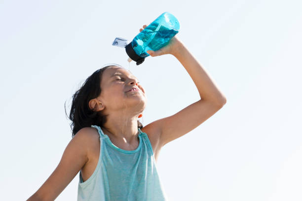 istock Little Girl Drinking Water 1488398741