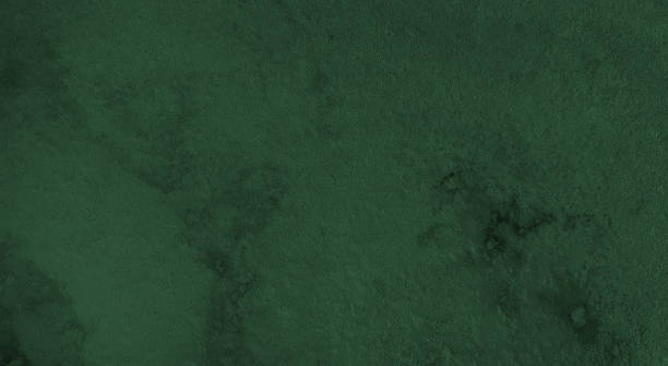 close up surface of dark green marble texture background, abstract texture for design. luxury and elegance marble for decoration. grainy marble stone in macro shot. emerald green color.