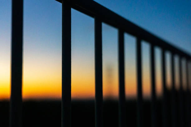 Beautiful sunset seen through the iron fence