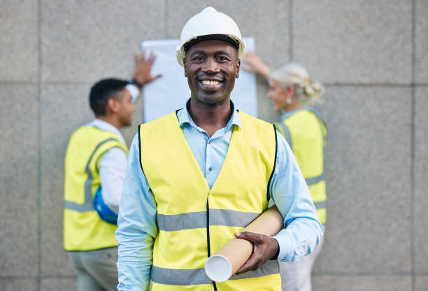 istock Black man, architect and portrait smile with blueprint in building or construction plan on site. Happy African American male engineer or contractor smiling with floor plan for industrial architecture 1488404111