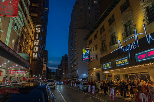 New York. USA. 09.22.2022. Evening view of people in line to see the famous musical at the August Wilson Theater on Broadway, Manhattan,