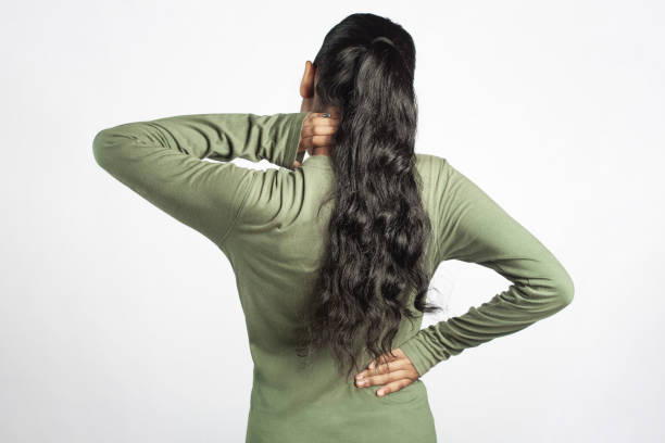 istock back side of a women showing her backache 1488406454