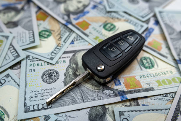 istock us dollars banknotes and car keys or remote control for duy rent insurence auto 1488409549