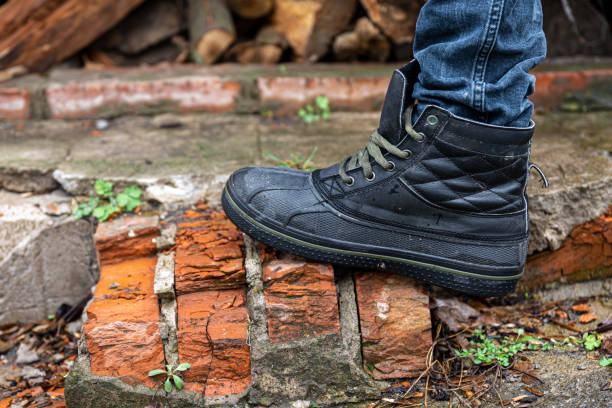 istock A pair of durable men's boots, legs close-up. 1488409621