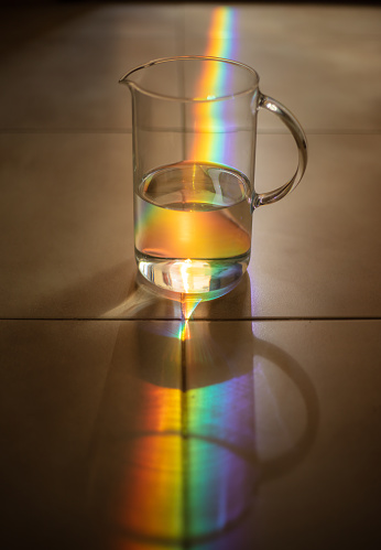 Reflecting prism lights on water.
