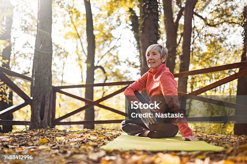 istock Senior Woman Practicing Yoga 1488412996