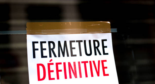 istock Taped Sign in Shop Window Reading FERMETURE DEFINITIVE 1488413068