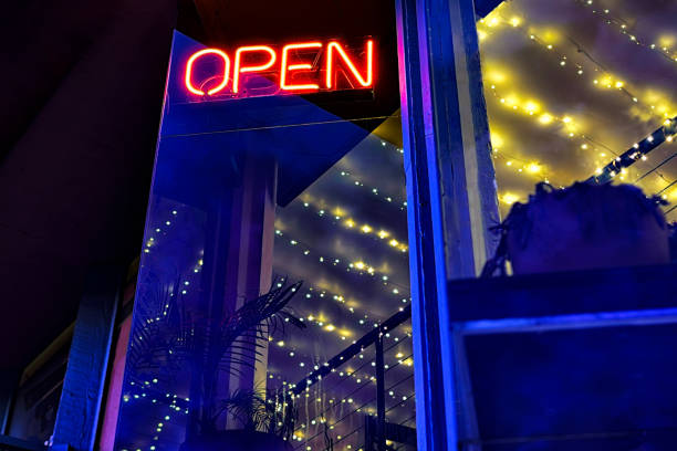 istock Red Open Sign on Building Exterior at Dusk Blue Hour 1488414883