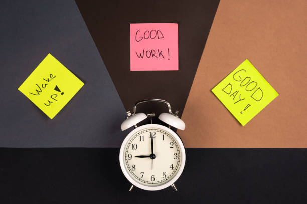 istock Alarm clock and stickers with motivational inscriptions, top view. 1488414954