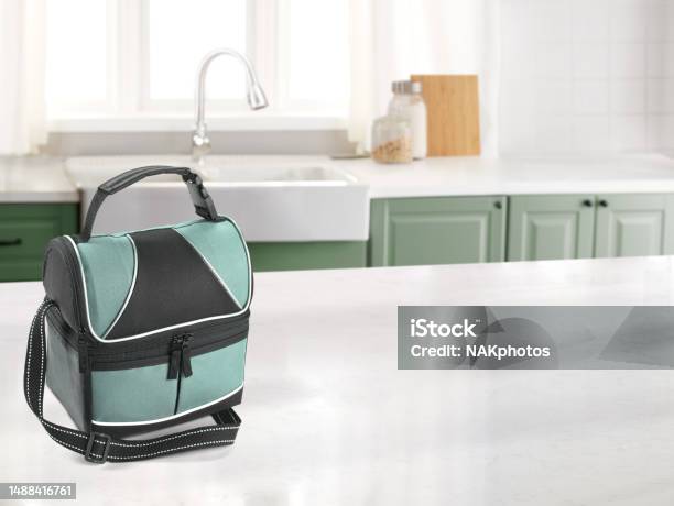 Lunch Bag In A Kitchen With A Marble Counter Top Stock Photo - Download Image Now - Kitchen Counter, Lunch Box, Packed Lunch