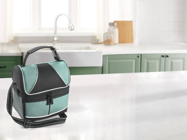 lunch bag in a kitchen with a marble counter top. - lunch box lunch box metal imagens e fotografias de stock