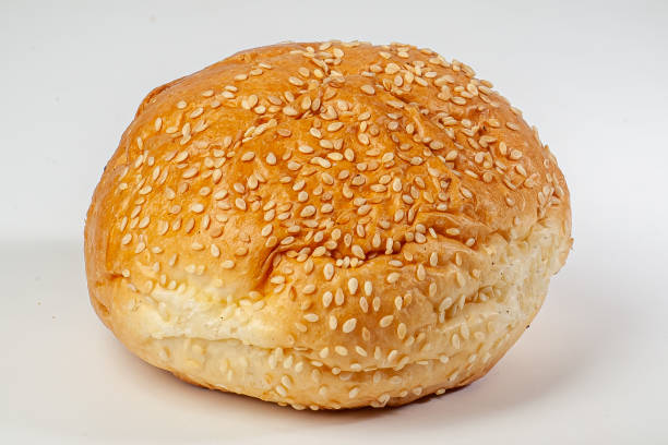 istock Arrangement of Three Burger Sesame Seed Buns isolated on white background 1488424744