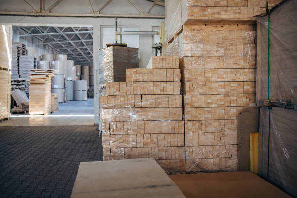 istock Cardboard stacks in factory warehouse 1488424951