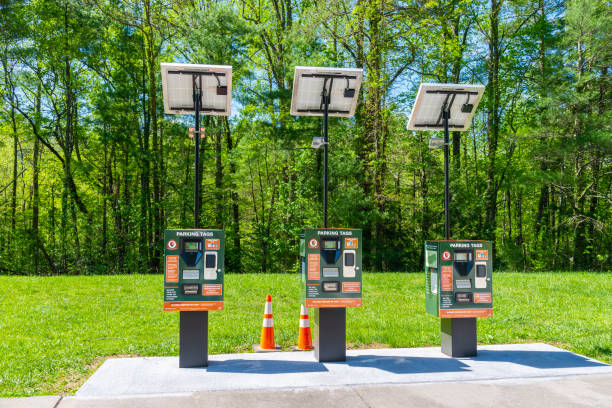 Just Installed Cades Cove GSMNP Parking Tag Solar Vending Machines Cades Cove, Tennessee, United States April 24, 2023: Horizontal shot of three Great Smoky Mountains National Park solar powered parking tags vending machines. tennessee road sign stock pictures, royalty-free photos & images