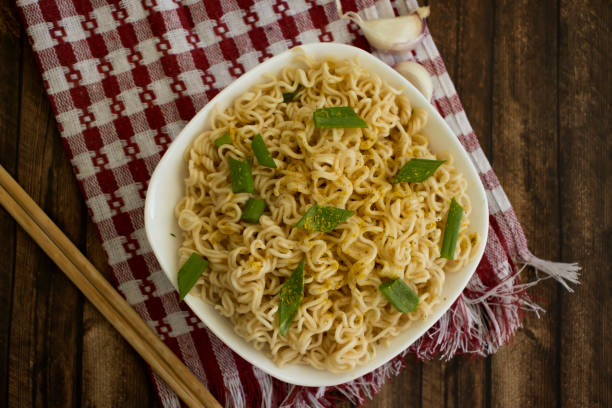 istock Noodles with green onions on background 1488426148