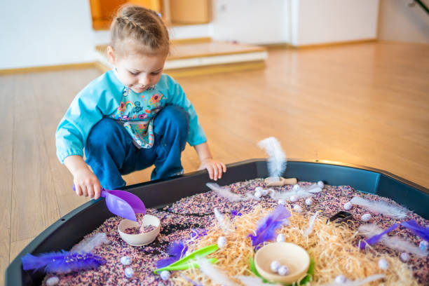 istock Little girl playing with sensory colorful rice. Sensory development and experiences, themed activities with children, fine motor skills development 1488426343