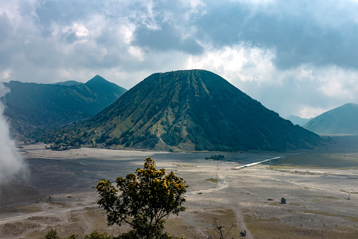 Mount Batok (Gunung Batok) an inactive volcano next to Mount Bromo (Gunung Bromo) an active somma volcano, Bromo Tengger Semeru National Park,  East Java, Indonesia.