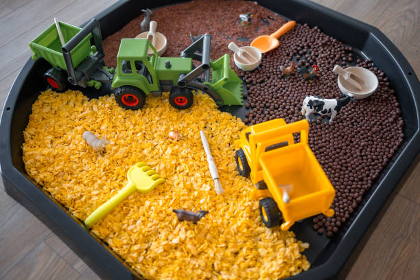 istock Sensory flakes like a sandbox for playing. Sensory development and experiences, themed activities with children, fine motor skills development 1488427853